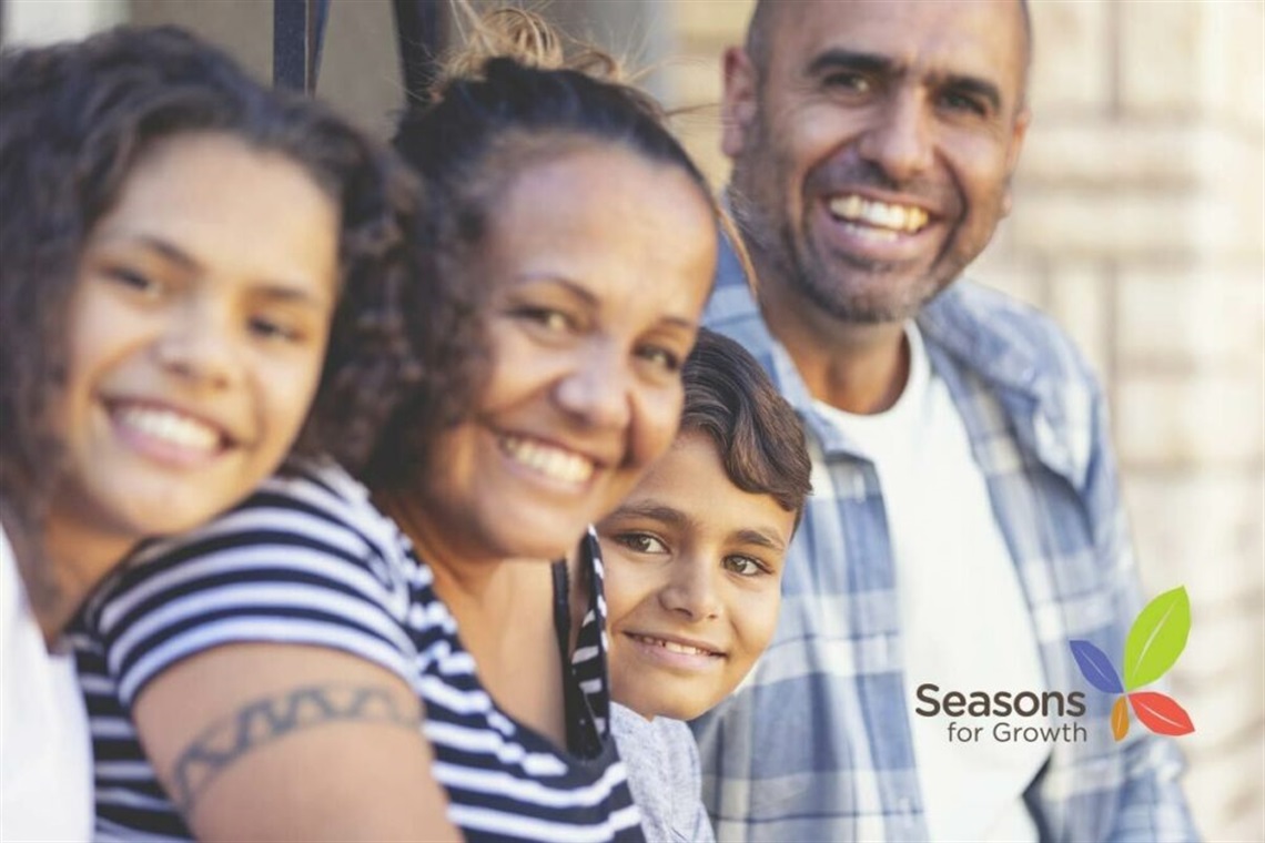 Family photo with Seasons for Growth logo