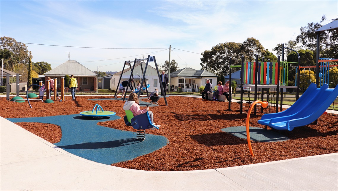 Photo of Brunner Park featuring children and families enjoying the space.