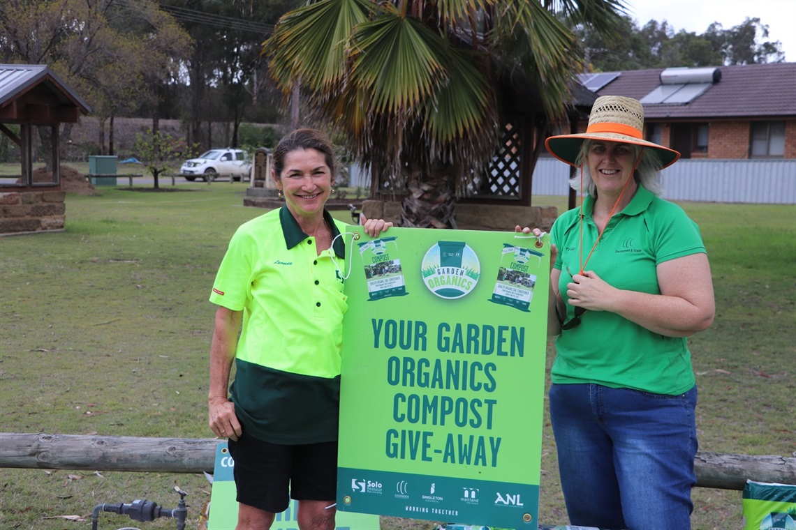 Council employees at a compost give-away event